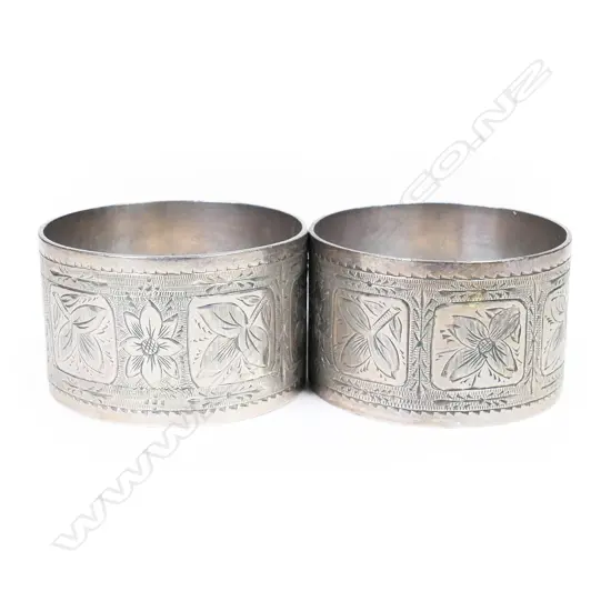 Frank Grady pair of silver napkin rings,